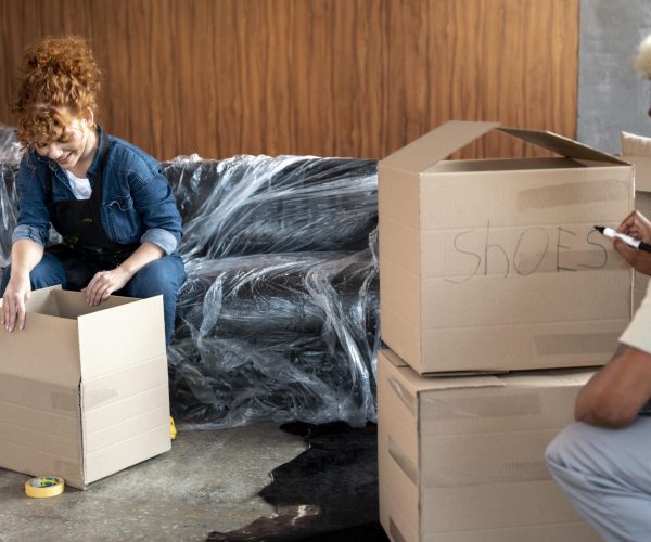 couple-with-cardboard-boxes-their-new-home