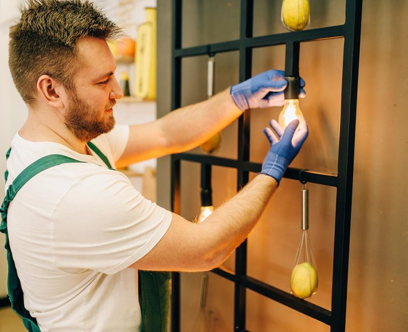 electrician-changes-the-light-bulb-handyman-resize.jpg
